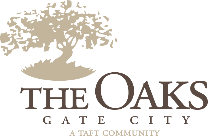 A logo for The Oaks Gate City, a Taft community, featuring a tree.